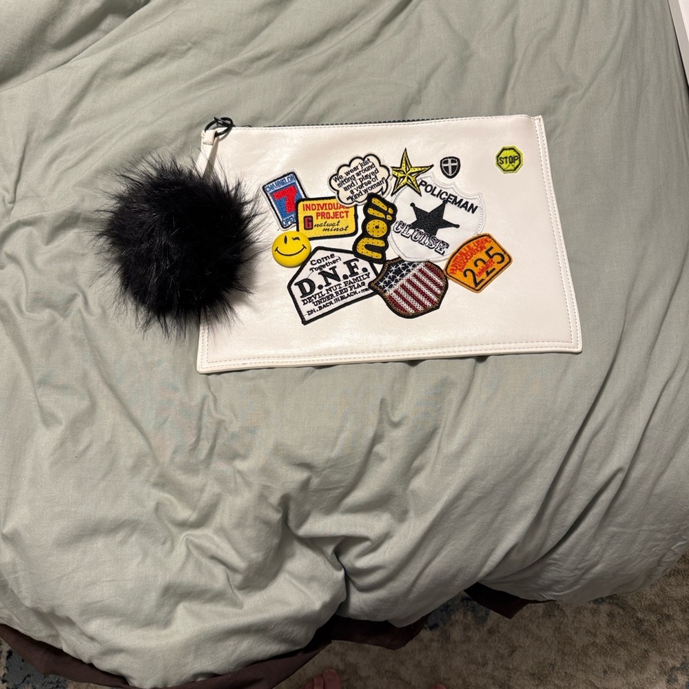 White Patchwork Pouch with Black Pom Pom